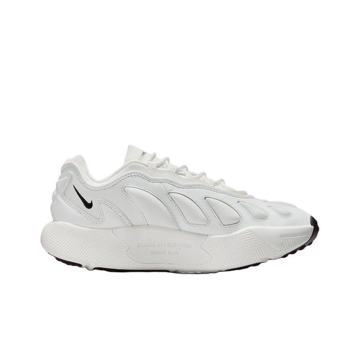 White low-top sneakers with Nike swoosh and textured quarter-panel detailing