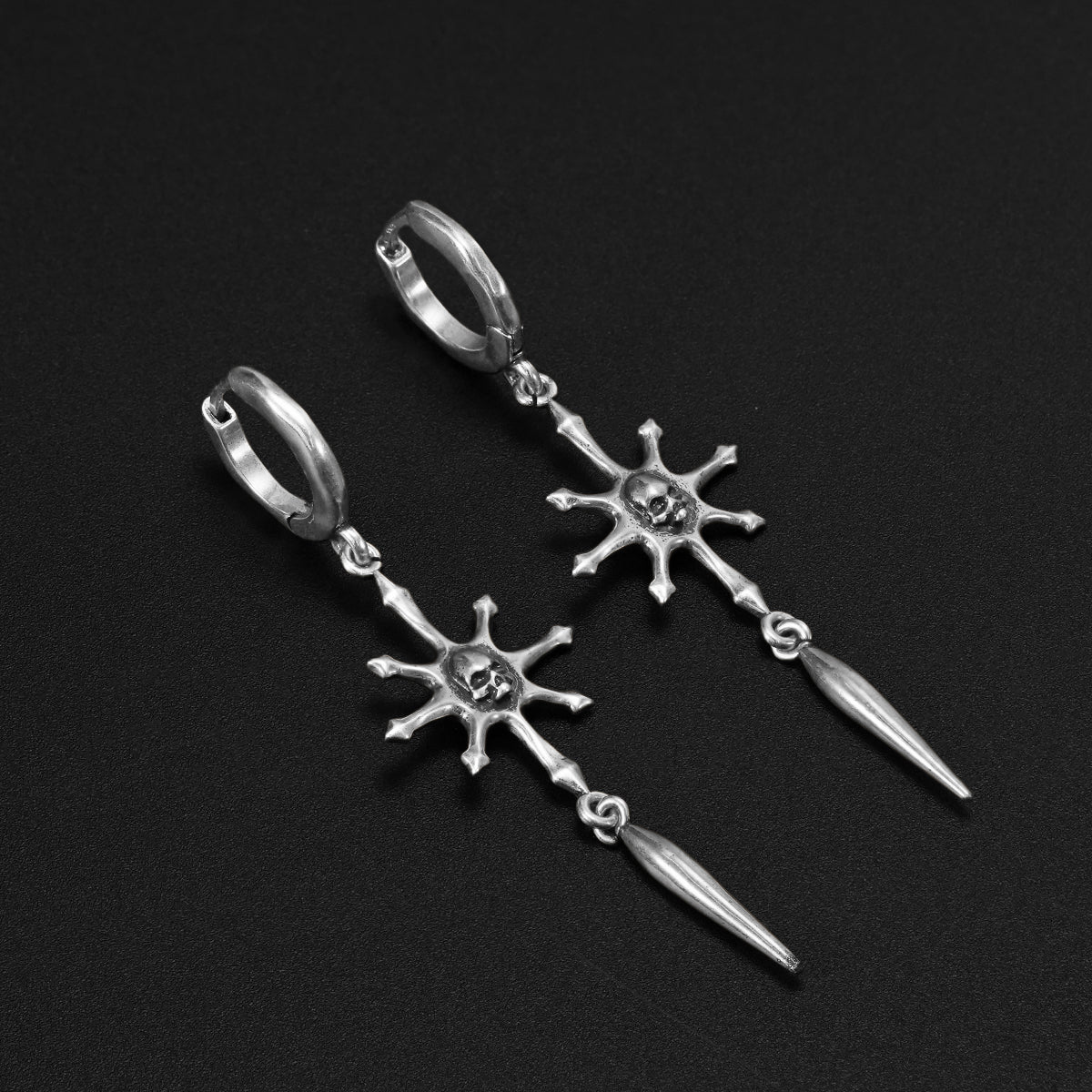 RADIANT SKULL SPEAR EARRINGS