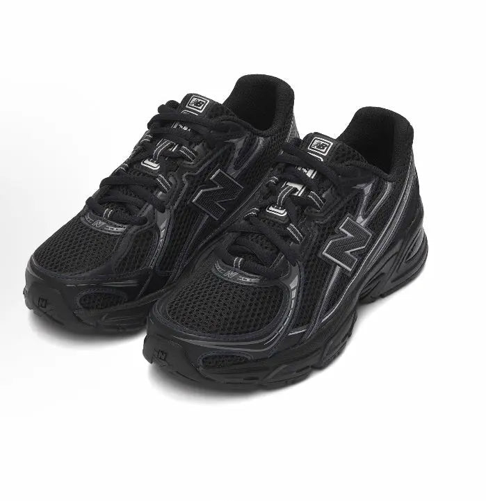 New Balance 740 sneakers, black mesh with silver N logo and lace-up