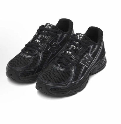 New Balance 740 sneakers, black mesh with silver N logo and lace-up