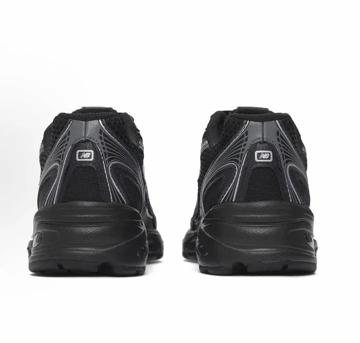 New Balance 740 sneakers, black heel view with cushioned back and tread