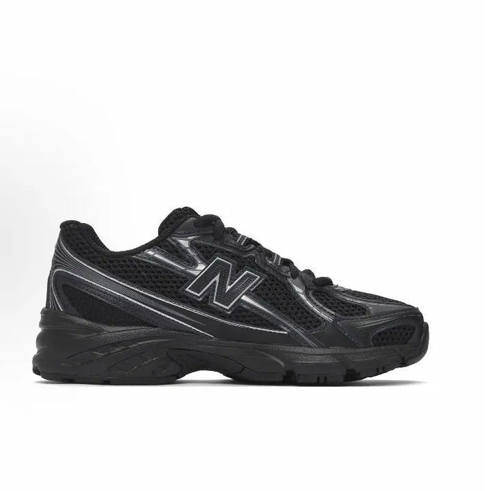 New Balance 740 sneakers, black quarter view with reflective N and lace-up