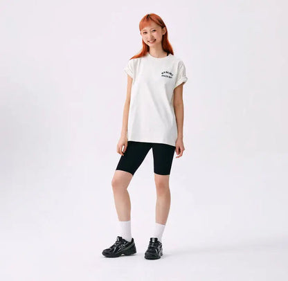 Black New Balance 740 sneakers on model, lace-up with chunky sole