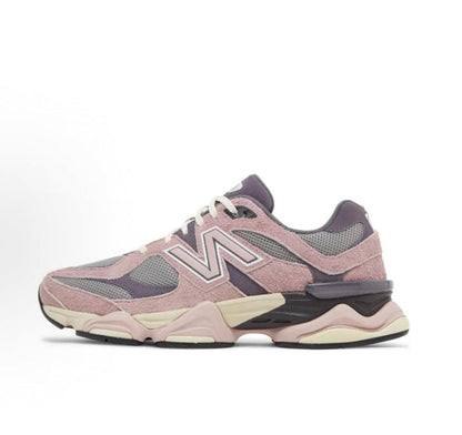 New Balance 9060 running sneaker, pink/grey/lavender, with oversized N logo.