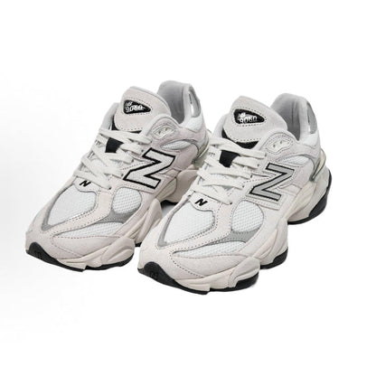 Grey chunky sneakers pair, lace-up with New Balance N logo on sides