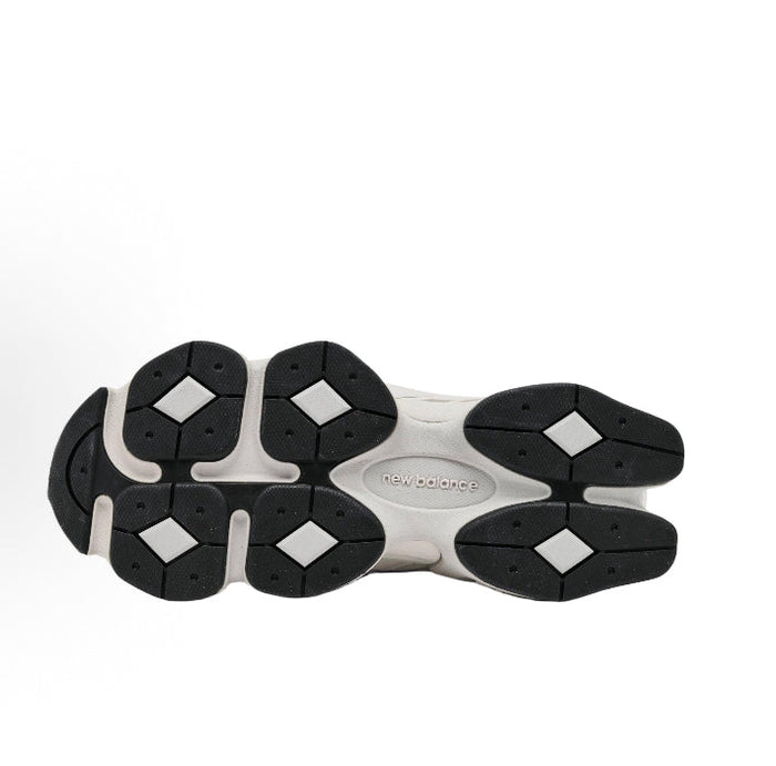 Chunky sneaker outsole with black traction pods and 'new balance' text