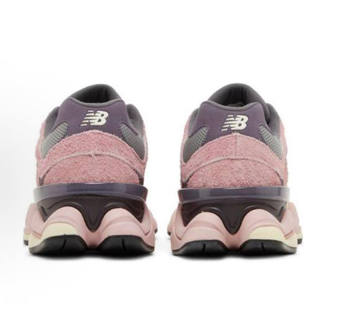 New Balance 9060 rear view sneaker in lavender and pink with black heel clip.