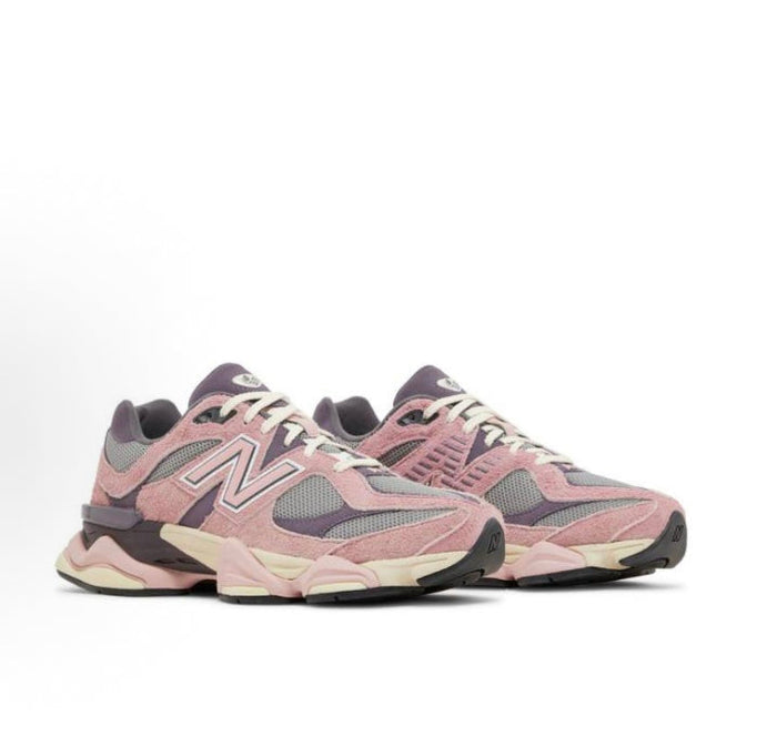 New Balance 9060 front side sneaker in pink, grey, and lavender with lace-up design.
