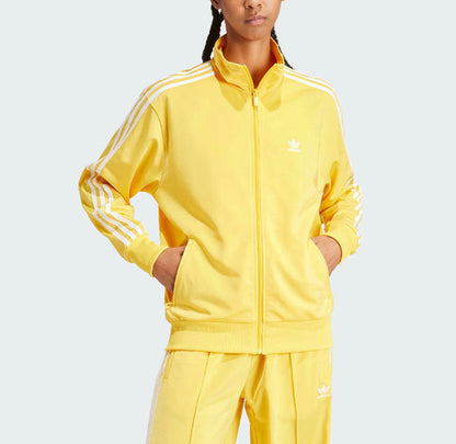 Yellow track jacket and pants set with Adidas logo and three side stripes