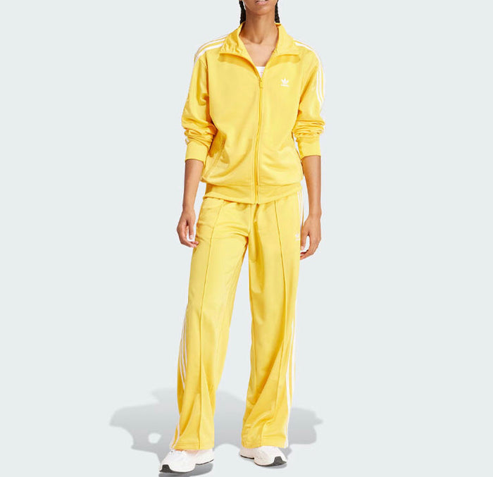 Yellow Adidas tracksuit with full-zip jacket, Adidas logo, and three side stripes