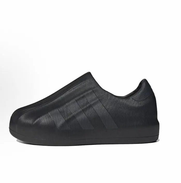 Black Adidas Adifom slip-on with textured knit upper and thick rubber sole