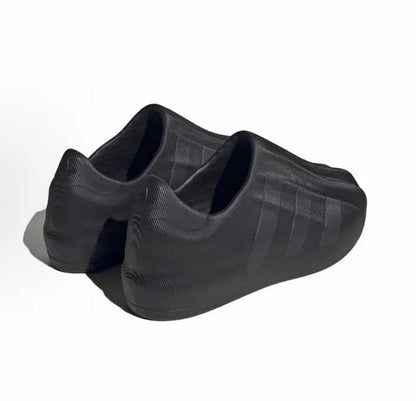 Black Adidas Adifom slip-on showing cushioned heel and sculpted side panels