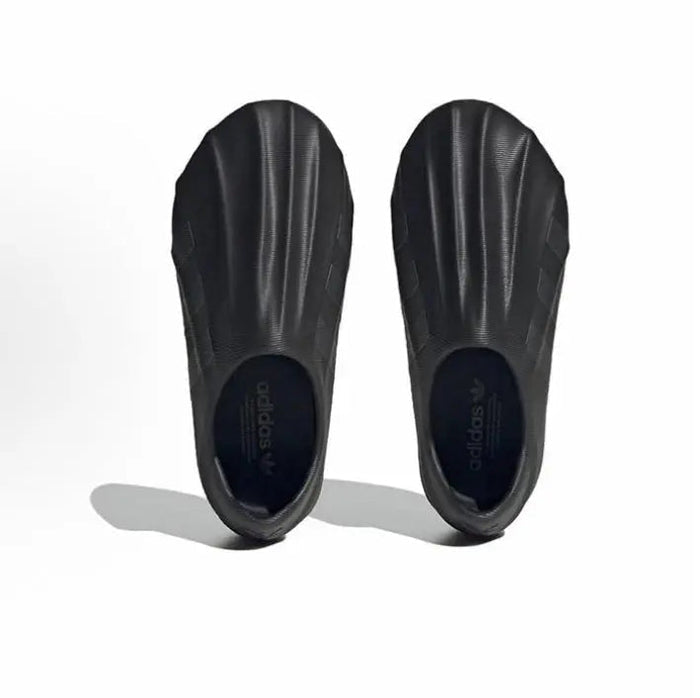Black Adidas Adifom slip-on pair viewed from inside showing inner logo