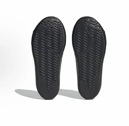 Black Adidas Adifom outsoles with textured herringbone tread pattern