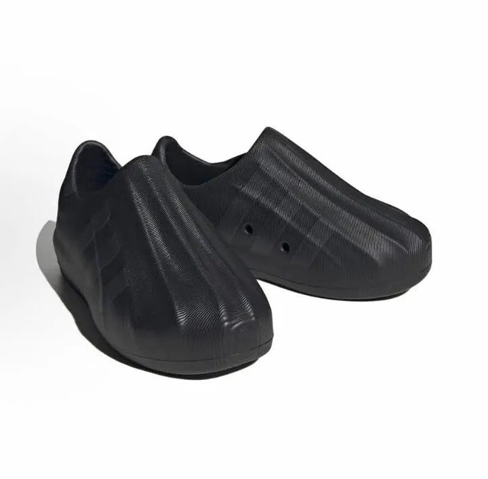 Black Adidas Adifom slip-on pair from the back with vented upper and heel pad