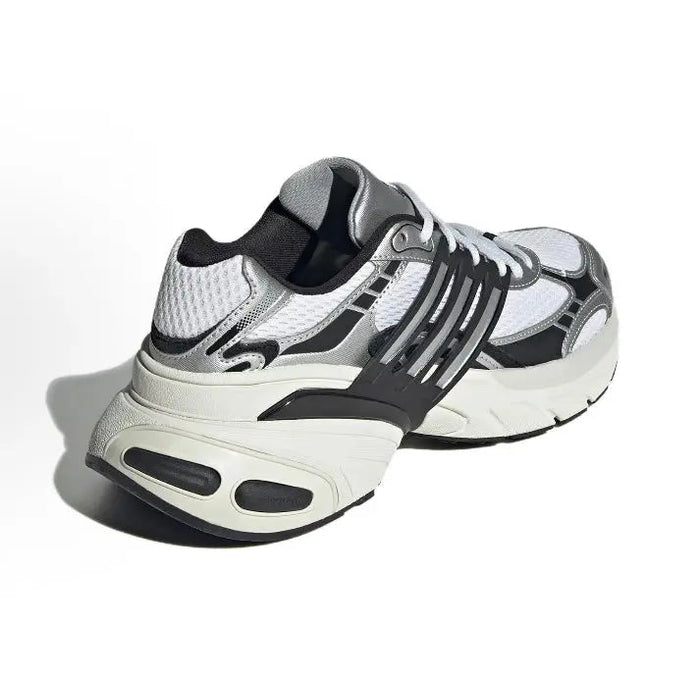 White low-top running shoes with dark gray heel, black stripes, and lace-up closure