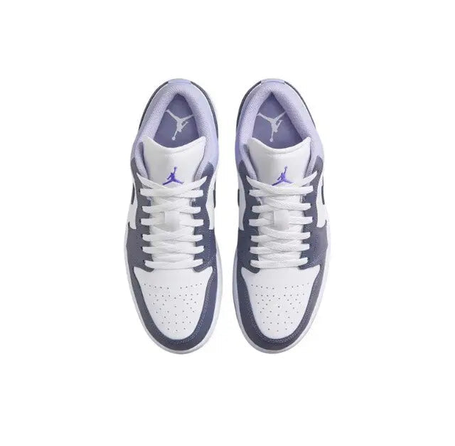 Pair of low-top sneakers with white uppers, navy overlays, and purple Jordan wing