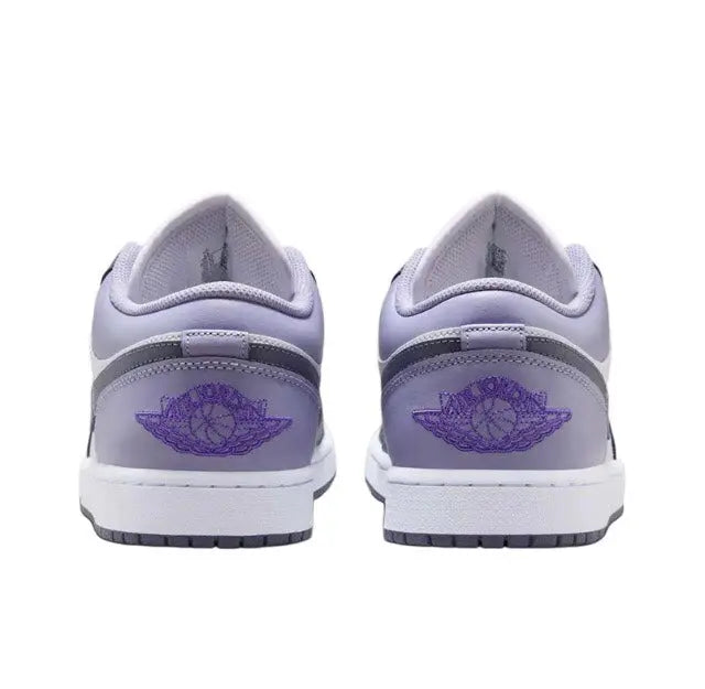 Pair of low-top sneakers with light gray heel, purple wing emblem, and white midsole