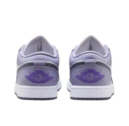 Pair of low-top sneakers with light gray heel, purple wing emblem, and white midsole