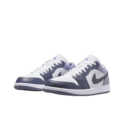 Low-top sneakers with white leather, navy toe and collar, purple laces, and Nike swoosh