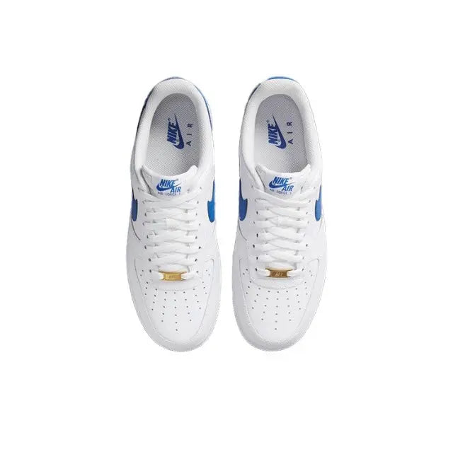 Pair of white low-top sneakers with blue Nike swoosh and lace-up closure