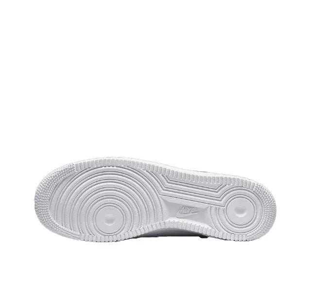 White rubber outsole with circular traction pattern for Nike low-top sneakers