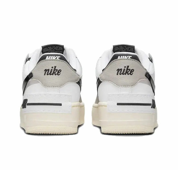 Nike low-top sneakers, rear view with Nike branding on off-white heel