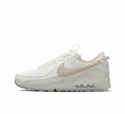 Nike Air Max 90 sneaker in light bone with beige swoosh and visible Air sole