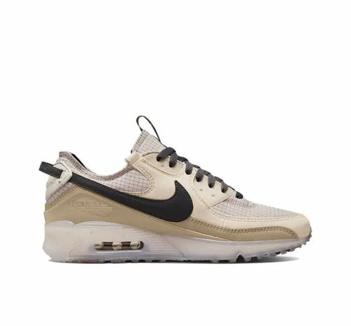 Nike Air Max 90 sneakers in light beige with black Swoosh and visible Air sole
