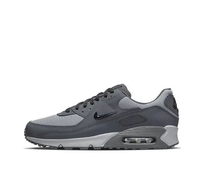 Nike Air Max 90 sneakers in dark gray with black and light gray accents, lace-up