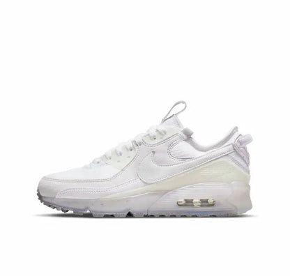 Air Max 90 sneakers, white upper with visible Air cushioning sole.