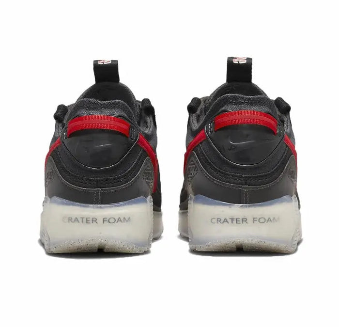 Nike Air Max 90 sneakers, rear view; black heel with red strap and white midsole foam