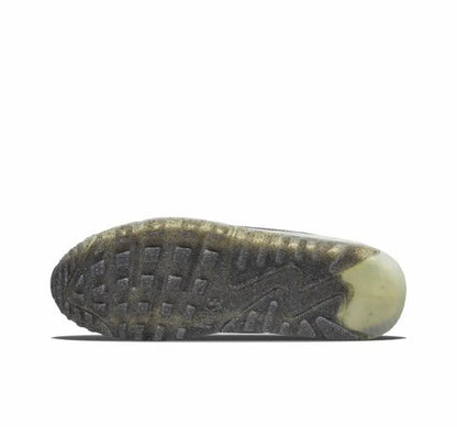 Nike Air Max 90 outsole view with dark tread and pale green accent