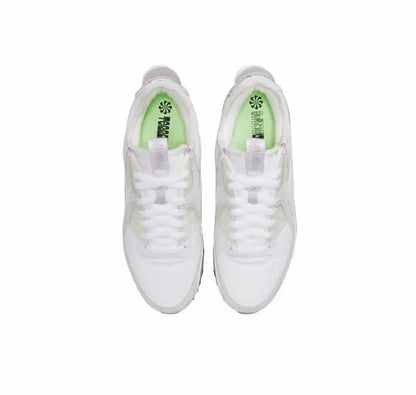 Air Max 90 sneakers, white uppers with lime-green insoles and lace-up tongues.
