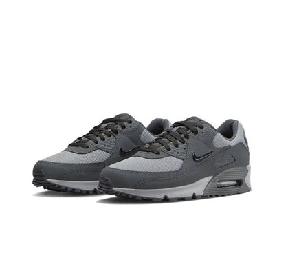Air Max 90 sneakers, pair view, dark gray knit upper with black Swoosh and gray toe