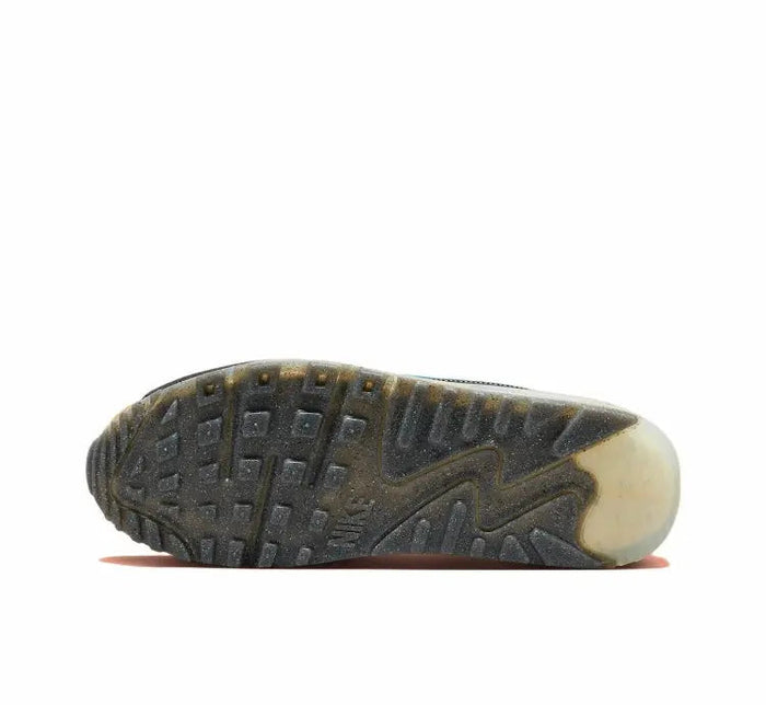 Nike Air Max 90 outsole with dark tread and tan edge, sneaker bottom view