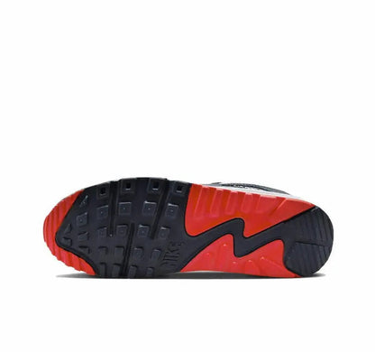 Nike Air Max 90 outsole with dark traction pods and red forefoot accent