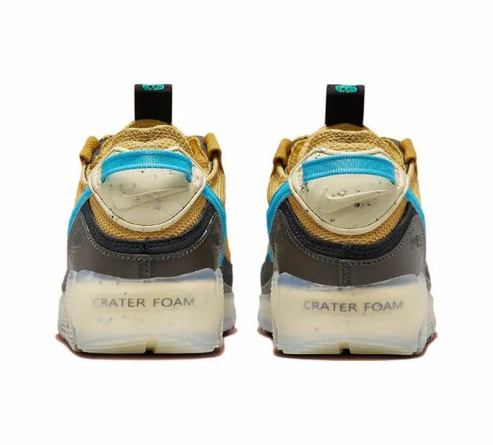 Nike Air Max 90 heel view with blue collar, green laces and Crater Foam branding