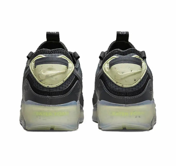Nike Air Max 90 heel view, dark upper with lime-green heel panel and Air unit