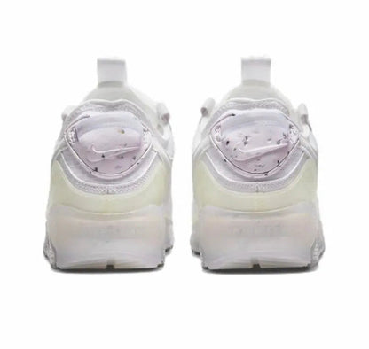 Air Max 90 sneakers, rear view with white upper and light yellow Air midsole.