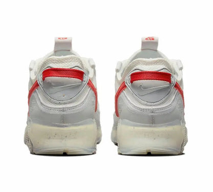 Nike Air Max 90 heel view, white upper with red strap detail and Air unit