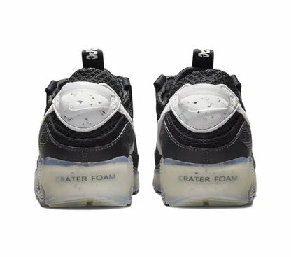Nike Air Max 90 heel view, dark upper with CRATER FOAM text on foam midsole