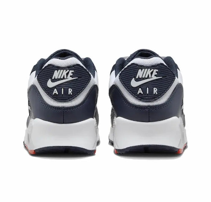 Nike Air Max 90 heel-toe view with navy upper, white midsole, Nike Air branding