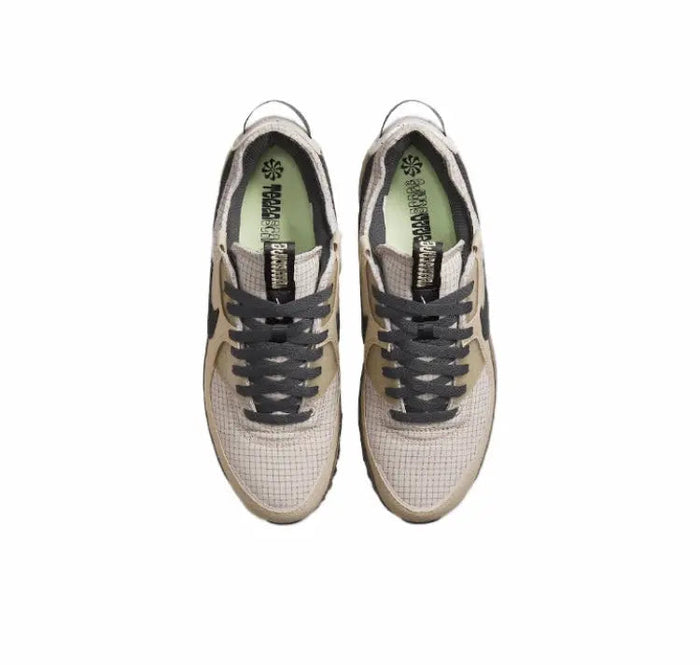 Nike Air Max 90 sneakers with light beige knit uppers and black lace panel detail