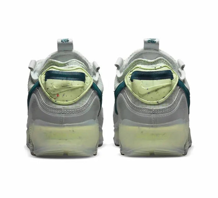 Air Max 90 sneakers back view, white uppers with teal heel detail and lime midsole