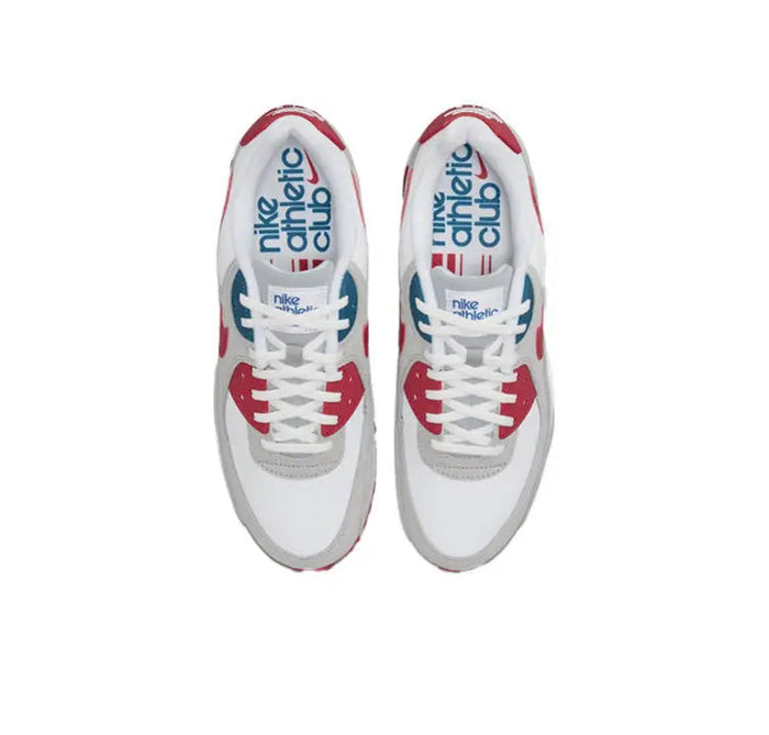 Air Max 90 sneakers, white uppers with red trim and blue/red NIKE Air branding