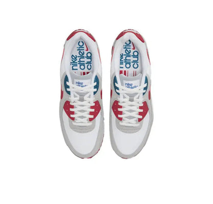 Air Max 90 sneakers, white uppers with red trim and blue/red NIKE Air branding