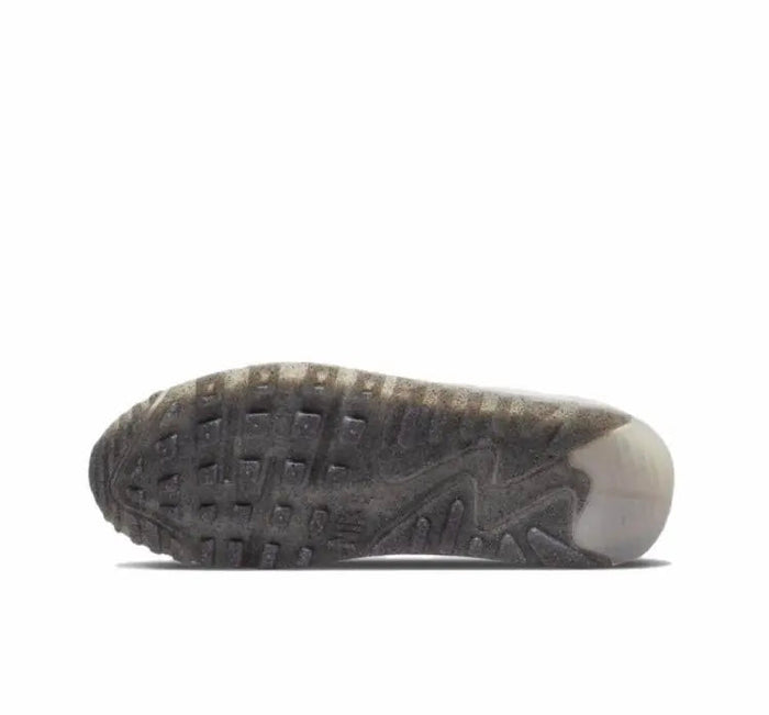 Air Max 90 sneakers outsole, dark traction tread with side grooves.