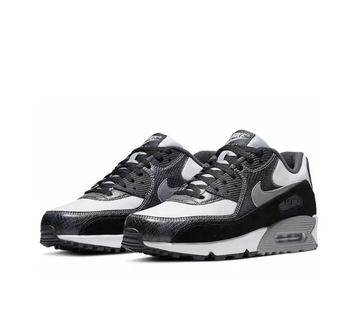 Air Max 90 running shoe side view, white upper with black overlays and gray laces
