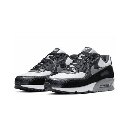 Air Max 90 running shoe side view, white upper with black overlays and gray laces